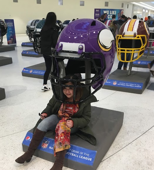 Sitting under a Minnesota Vikings helmet display